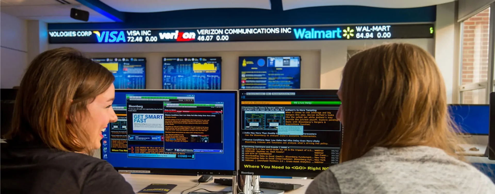 A custom LED stock ticker display used in a school's financial lab. By Rise Display.