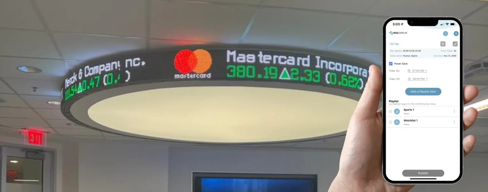 Rise Display app on a mobile device in front of a custom curved LED stock ticker.