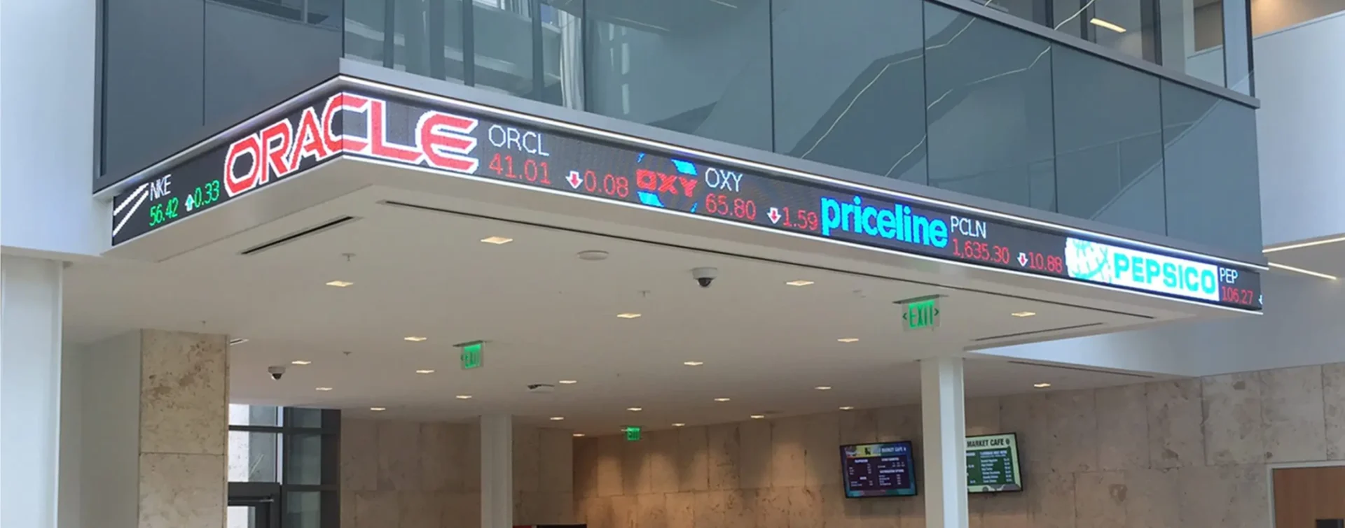 Rise Display custom outdoor LED ticker displaying logo art and scrolling information.