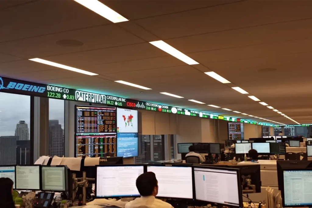 A Rise Display LED stock ticker in a PIMCO financial classroom.