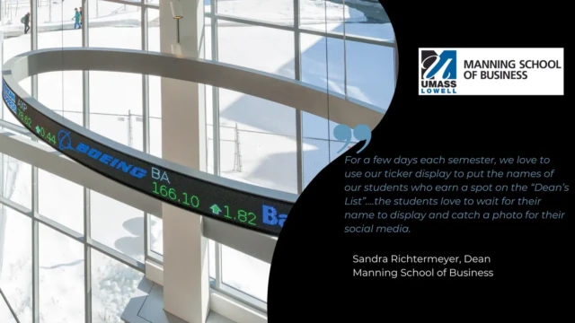 A custom, suspended stock ticker display at UMASS Lowell Manning School of Business by Rise Display. A custom, suspended stock ticker display at UMASS Lowell Manning School of Business by Rise Display.